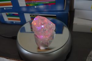 This is a gorgeous quartz point and you can see I have it on an LED rotating mirrored stand. The stands are also for sale and this one has an adapter so it can be plugged in or you can use batteries.